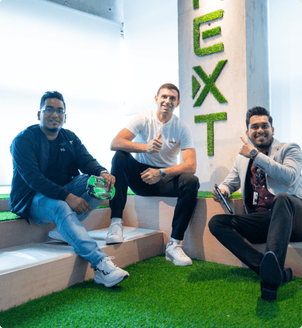 Three FundedNext Employees Sitting Around Chatting