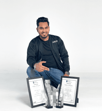 Abdullah Jayed, CEO at FundedNext Sitting with Awards and Smiling for Photo